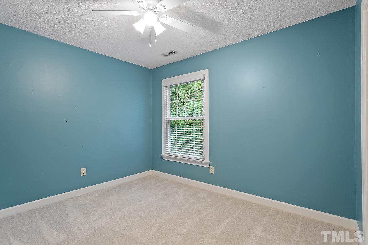 8408 Morgans Way Raleigh, NC 27613 - Photo 21 of 34 a view of a livingroom with a ceiling fan and window