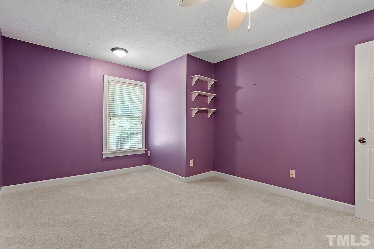 8408 Morgans Way Raleigh, NC 27613 - Photo 23 of 34 an empty room with windows and closet