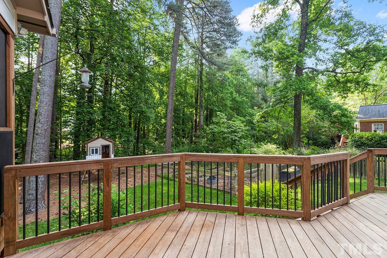 8408 Morgans Way Raleigh, NC 27613 - Photo 27 of 34 a view of wooden deck and a garden