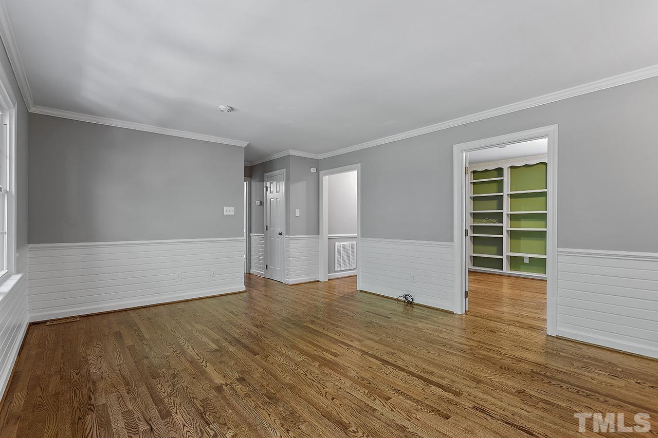 8408 Morgans Way Raleigh, NC 27613 - Photo 29 of 34 a view of an empty room with wooden floor and a window
