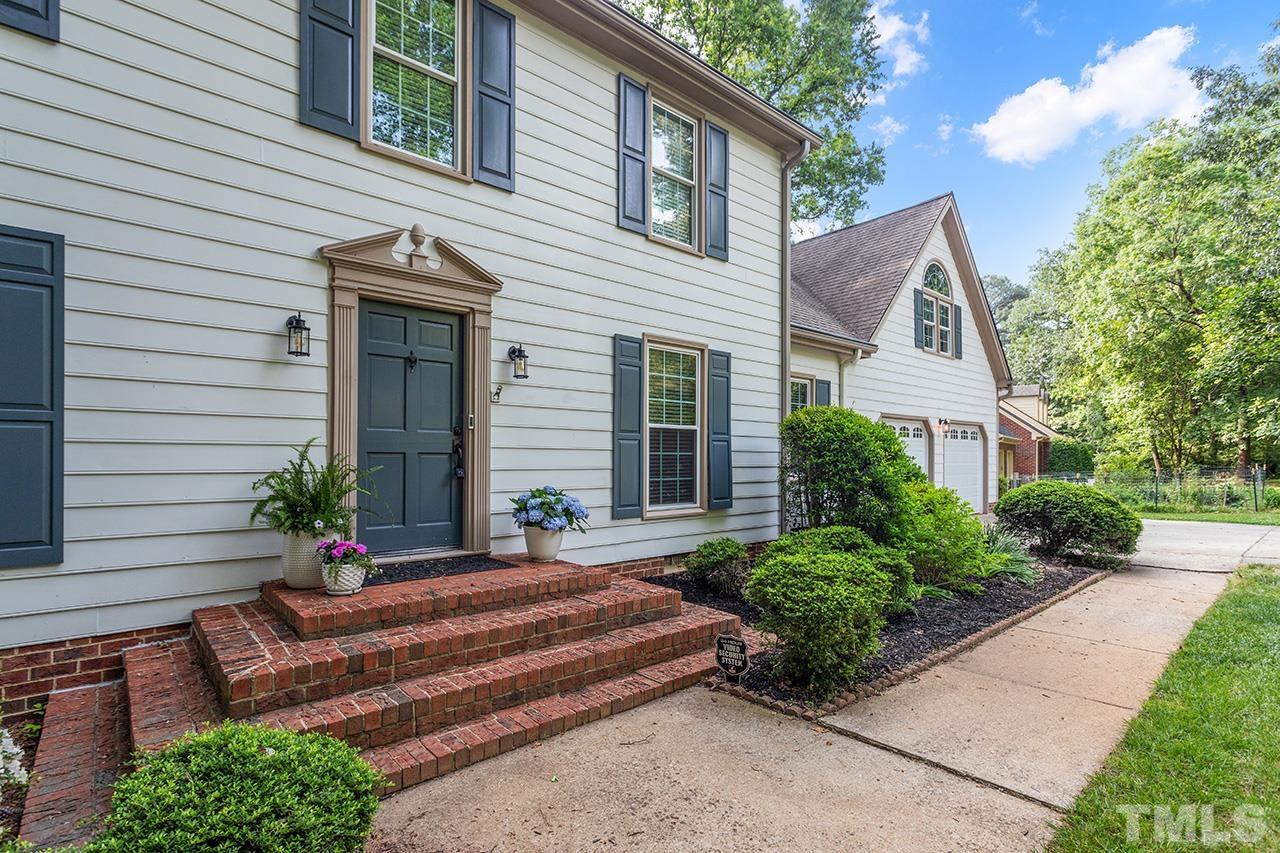 8408 Morgans Way Raleigh, NC 27613 - Photo 3 of 34 a front view of a house with garden