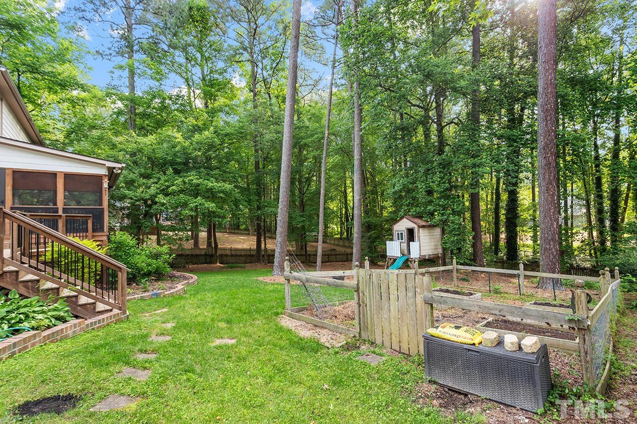 8408 Morgans Way Raleigh, NC 27613 - Photo 33 of 34 a view of a house with backyard and porch