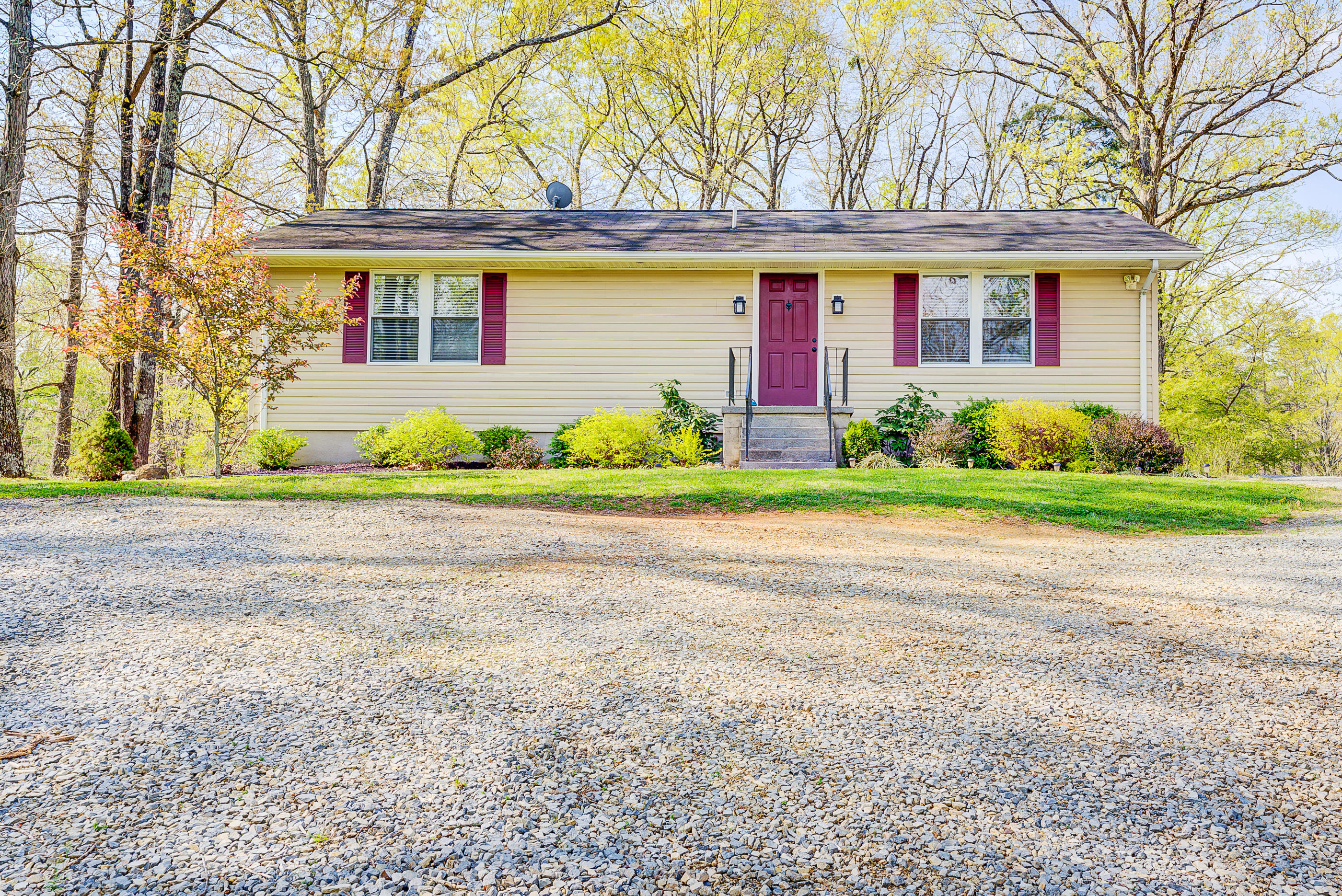 a front view of house with yard and green space