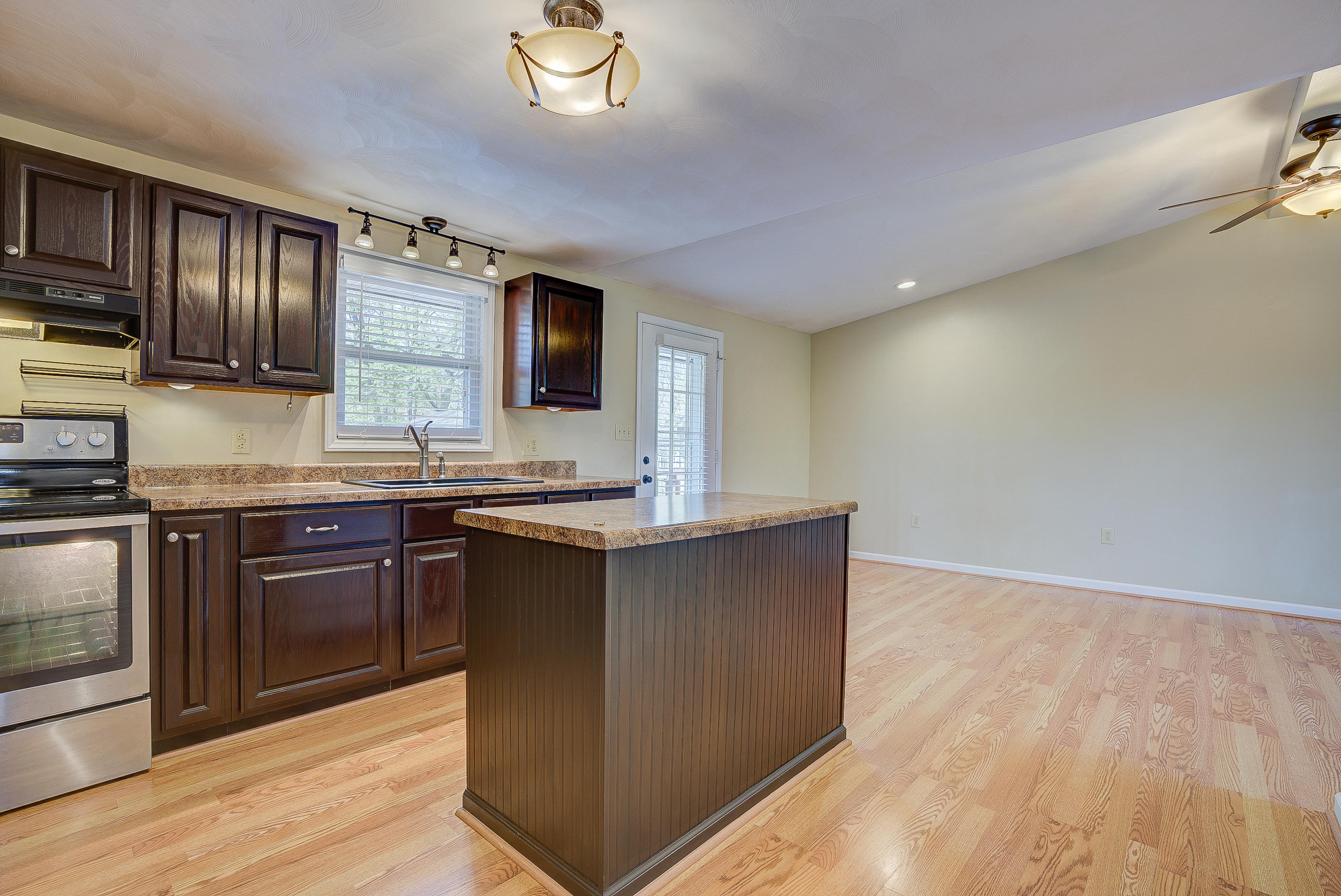 12267 Hardy Road Hardy, VA 24101 - Photo 12 of 24 a kitchen with granite countertop a sink cabinets and stainless steel appliances