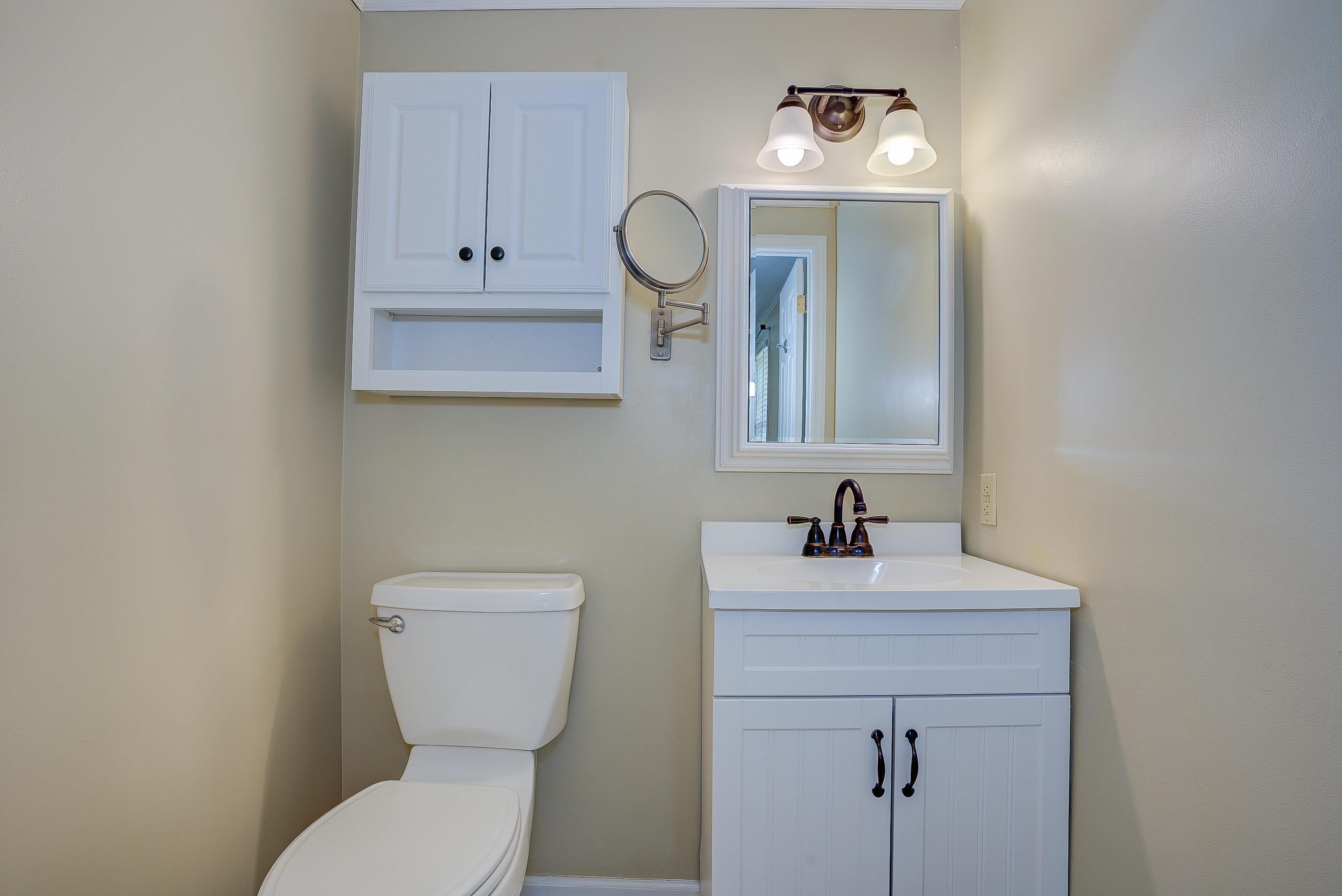 12267 Hardy Road Hardy, VA 24101 - Photo 16 of 24 a bathroom with a toilet a sink and mirror