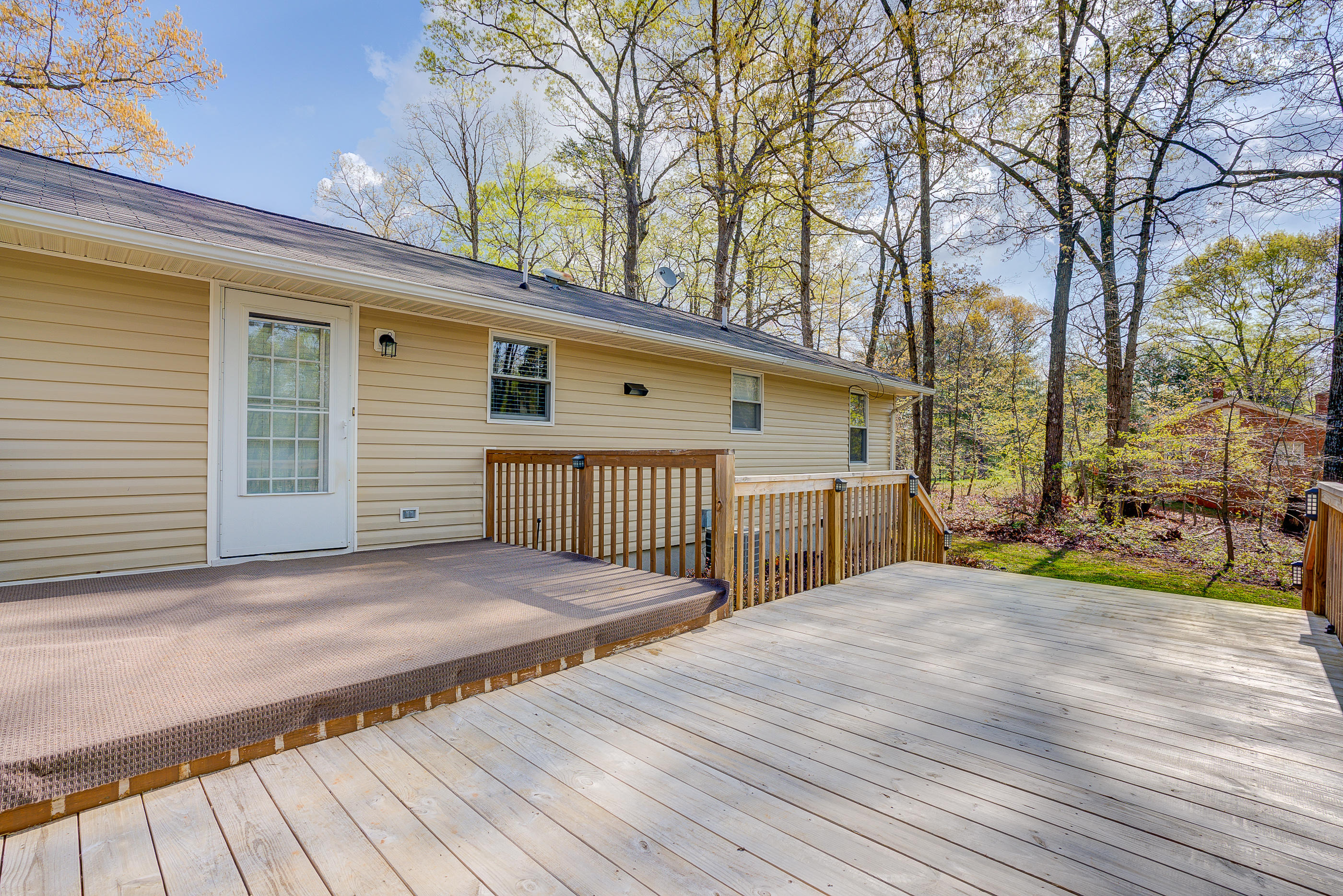 12267 Hardy Road Hardy, VA 24101 - Photo 20 of 24 a view of a house with a wooden roof and trees