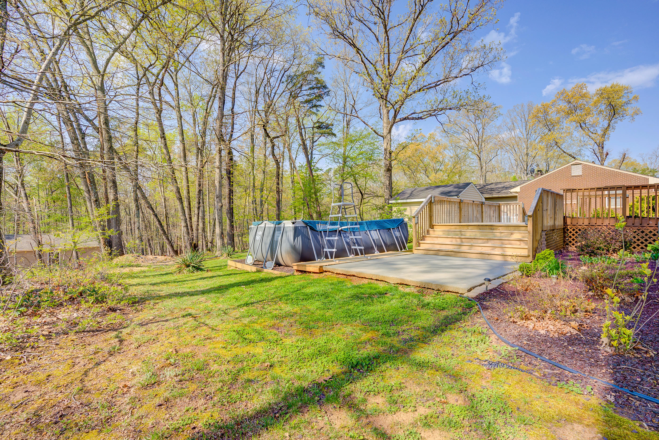 12267 Hardy Road Hardy, VA 24101 - Photo 23 of 24 a backyard of a house with barbeque oven table and chairs