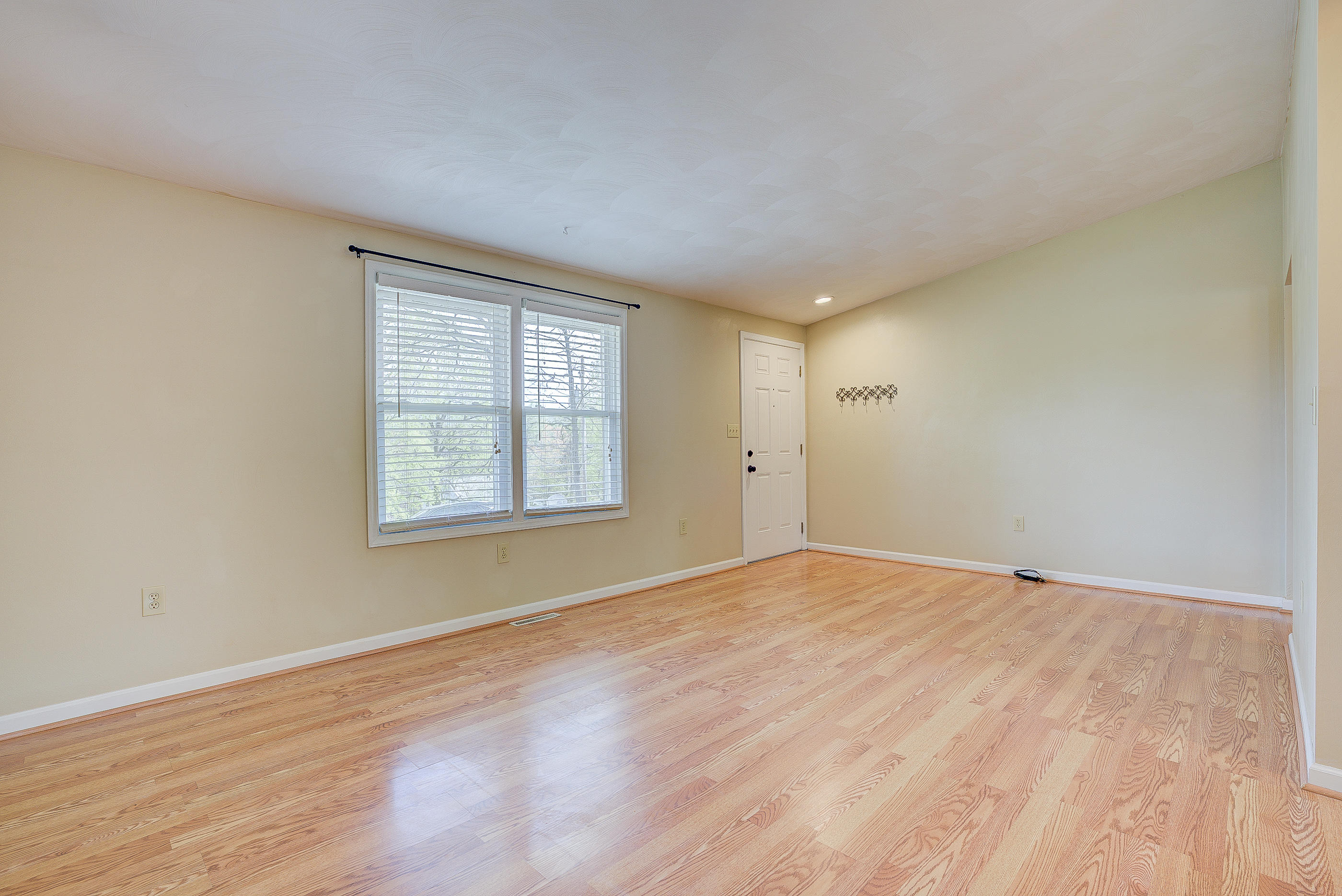 12267 Hardy Road Hardy, VA 24101 - Photo 5 of 24 a view of an empty room with wooden floor and a window