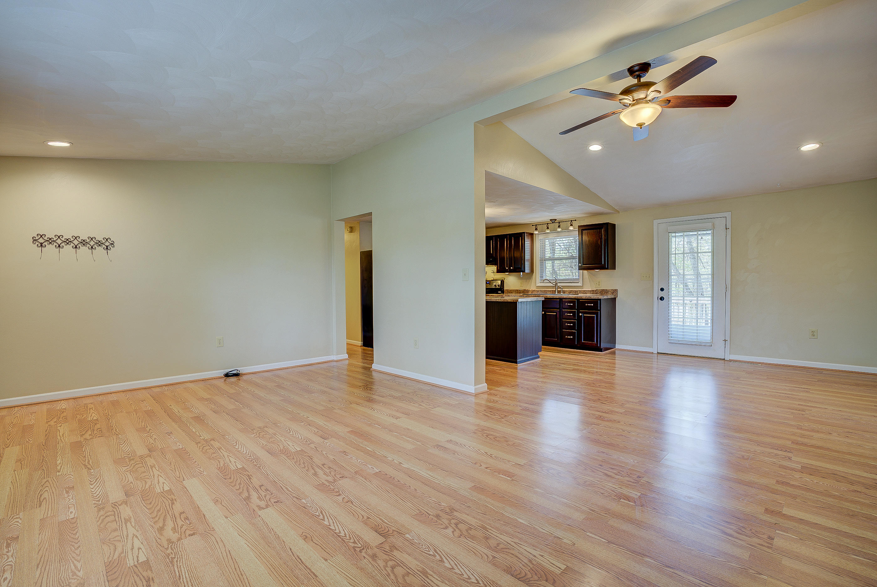 12267 Hardy Road Hardy, VA 24101 - Photo 6 of 24 a view of an empty room with a kitchen and a window