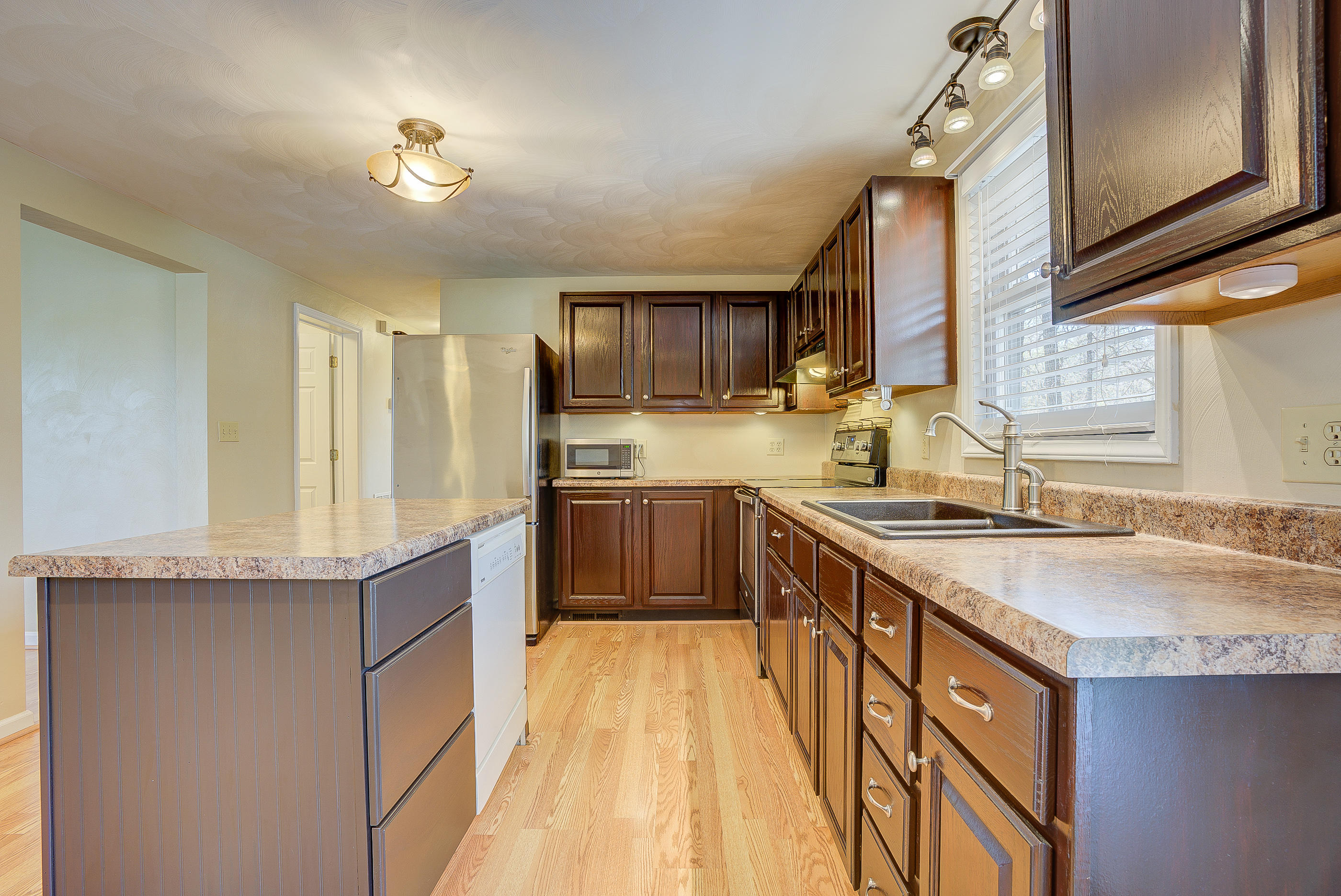 12267 Hardy Road Hardy, VA 24101 - Photo 8 of 24 a kitchen with stainless steel appliances granite countertop a sink stove and refrigerator