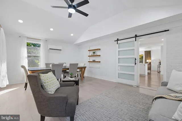 a view of a livingroom with furniture and a window