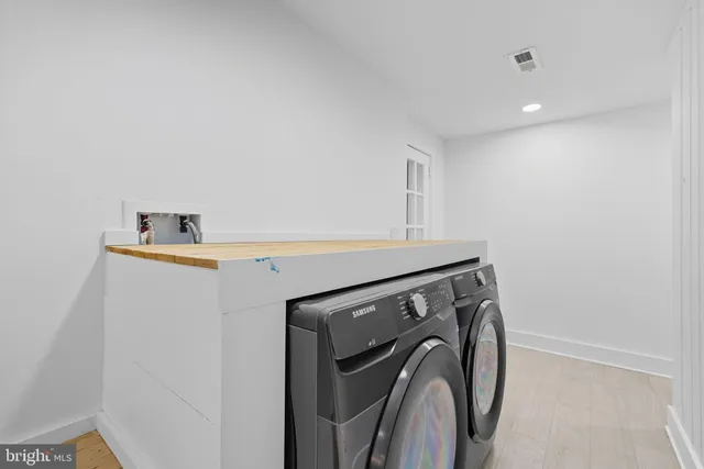 a utility room with dryer and washer