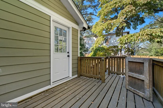 a view of balcony with wooden floor