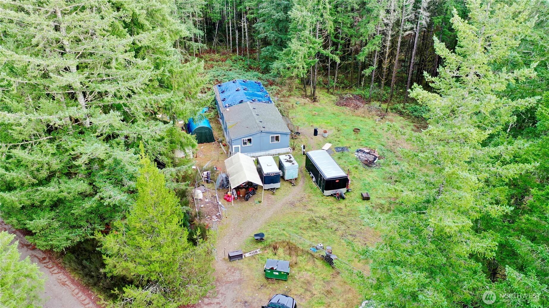 an aerial view of a house with a yard