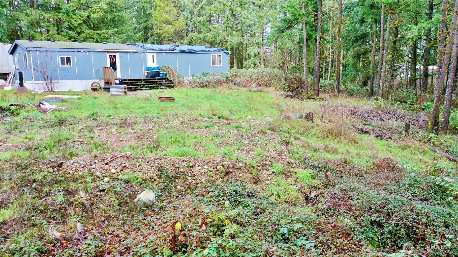 10185 May Ranch Lane Southwest Port Orchard, WA 98367 - Photo 4 of 14 a house view with a backyard space