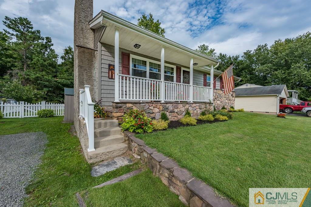 21 Mill Street Stockton, NJ 08559 - Photo 2 of 25 a view of a house with a yard and sitting area
