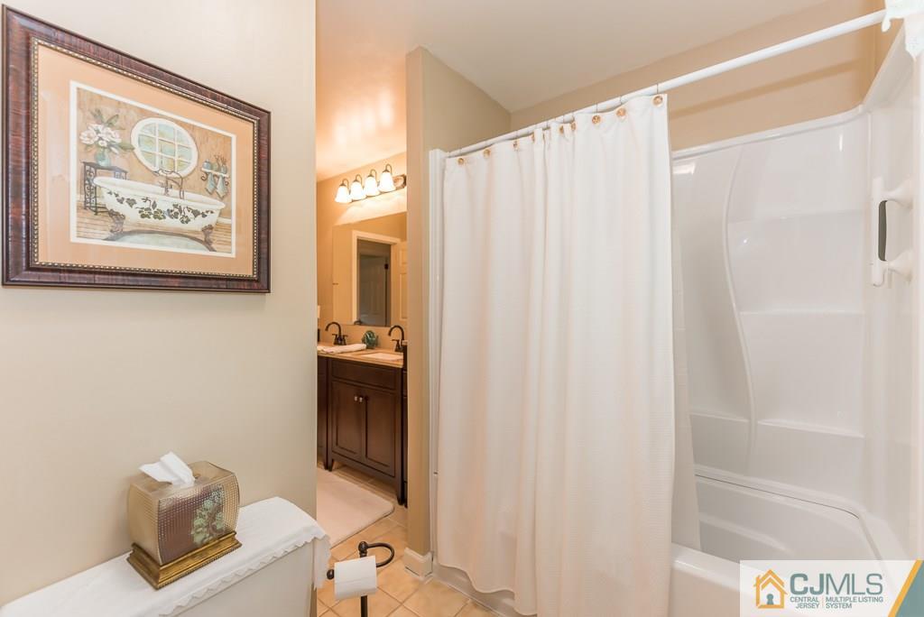 21 Mill Street Stockton, NJ 08559 - Photo 12 of 25 a bathroom with a shower and a sink