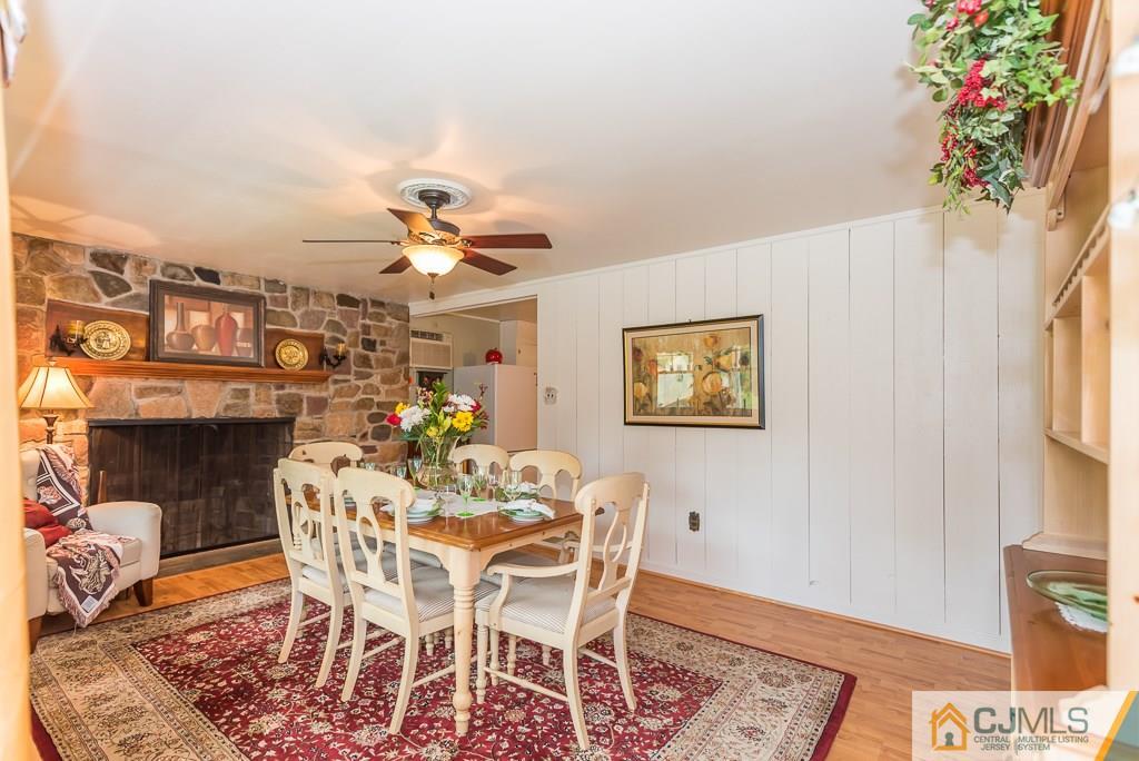 21 Mill Street Stockton, NJ 08559 - Photo 3 of 25 a view of a dining room with furniture and a chandelier