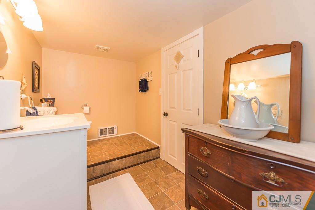 21 Mill Street Stockton, NJ 08559 - Photo 22 of 25 a bathroom with a sink and a mirror