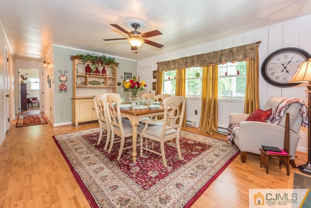 21 Mill Street Stockton, NJ 08559 - Photo 4 of 25 a view of a dining room with furniture a rug and wooden floor