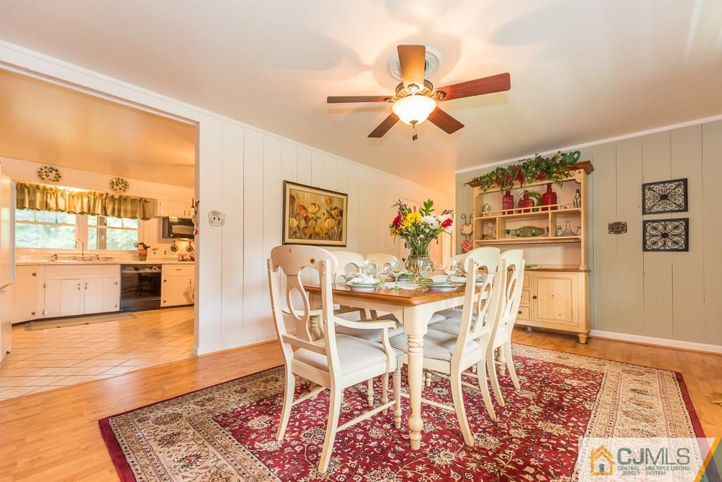 21 Mill Street Stockton, NJ 08559 - Photo 5 of 25 a view of a dining room with furniture and a chandelier