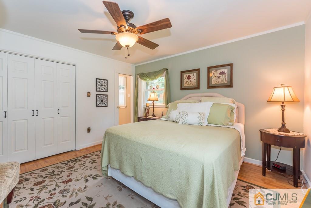 21 Mill Street Stockton, NJ 08559 - Photo 9 of 25 a spacious bedroom with a bed and a lamp