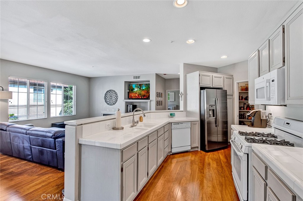 9 Darlington Irvine, CA 92620 - Photo 1 of 21 a kitchen with refrigerator a stove and a sink