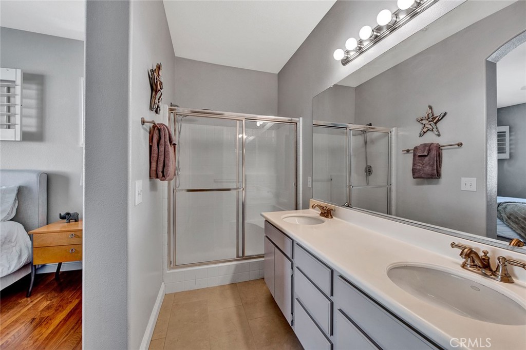 9 Darlington Irvine, CA 92620 - Photo 11 of 21 a bathroom with a tub sink and mirror