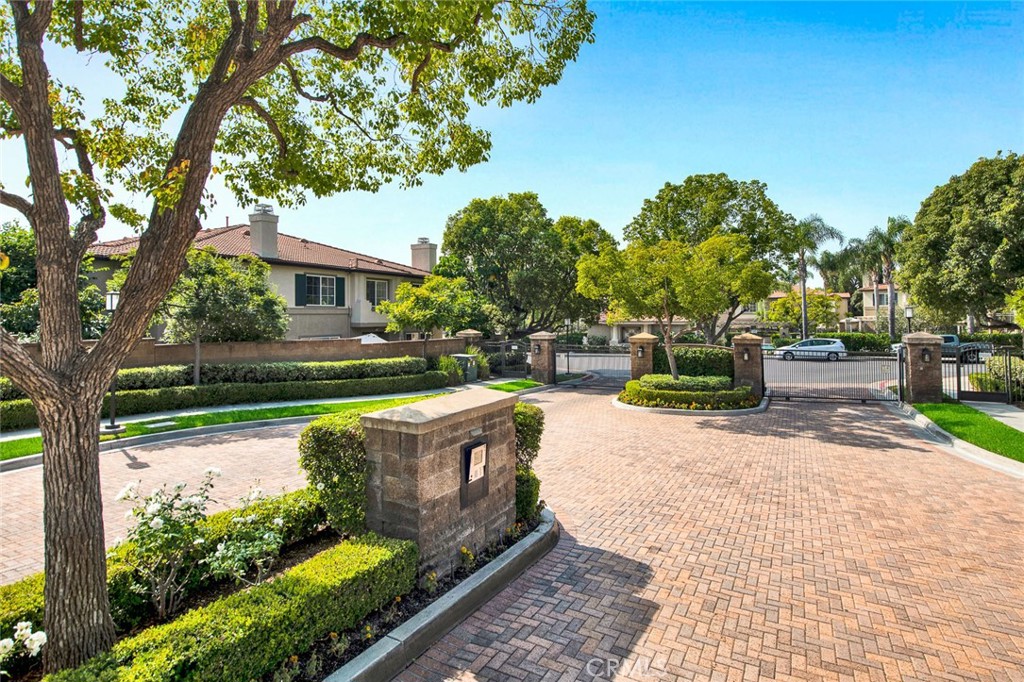 9 Darlington Irvine, CA 92620 - Photo 18 of 21 a view of a patio with table and chairs plants and large trees
