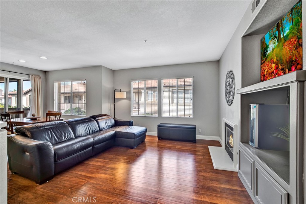9 Darlington Irvine, CA 92620 - Photo 3 of 21 a living room with furniture and a flat screen tv