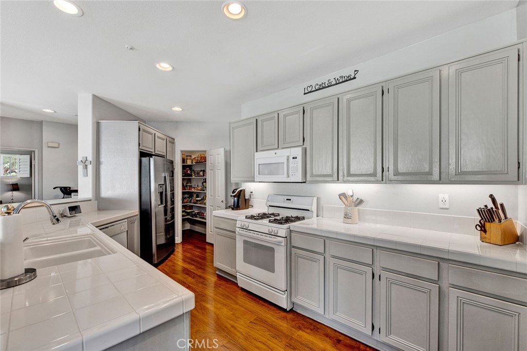 9 Darlington Irvine, CA 92620 - Photo 6 of 21 a kitchen with stainless steel appliances granite countertop a sink stove and refrigerator