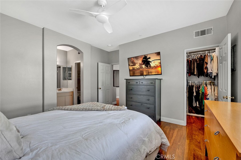 9 Darlington Irvine, CA 92620 - Photo 10 of 21 a bedroom with a bed and a flat screen tv