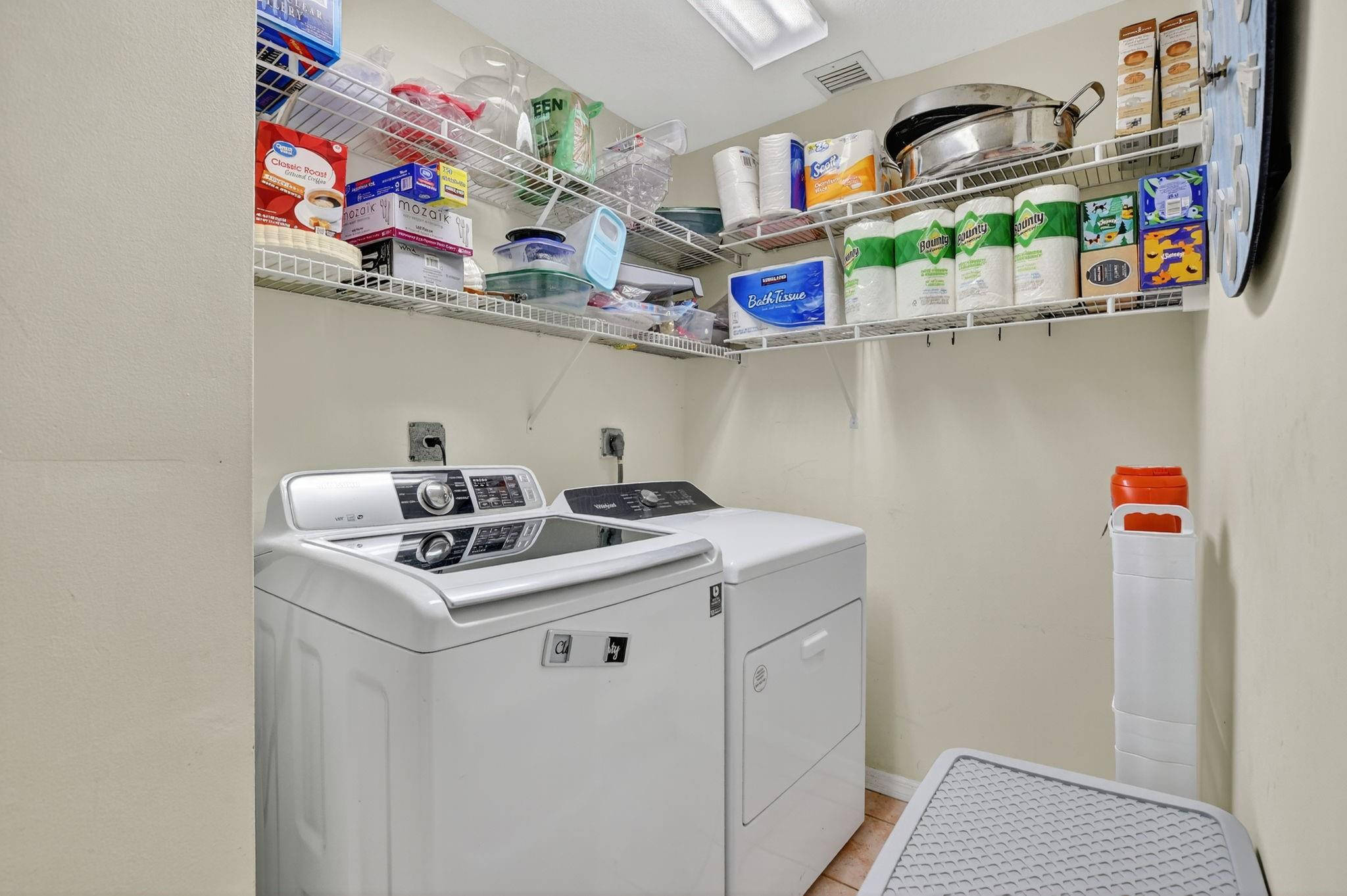 12614 Tiboli Chase Court, Unit 1 Boca Raton, FL 33496 - Photo 30 of 62 a utility room with stainless steel appliances a sink and wooden floor