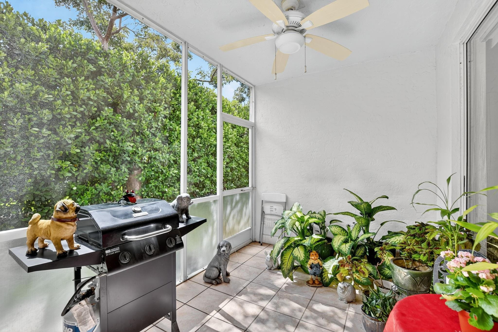 12614 Tiboli Chase Court, Unit 1 Boca Raton, FL 33496 - Photo 31 of 62 a dining room with furniture and a potted plant