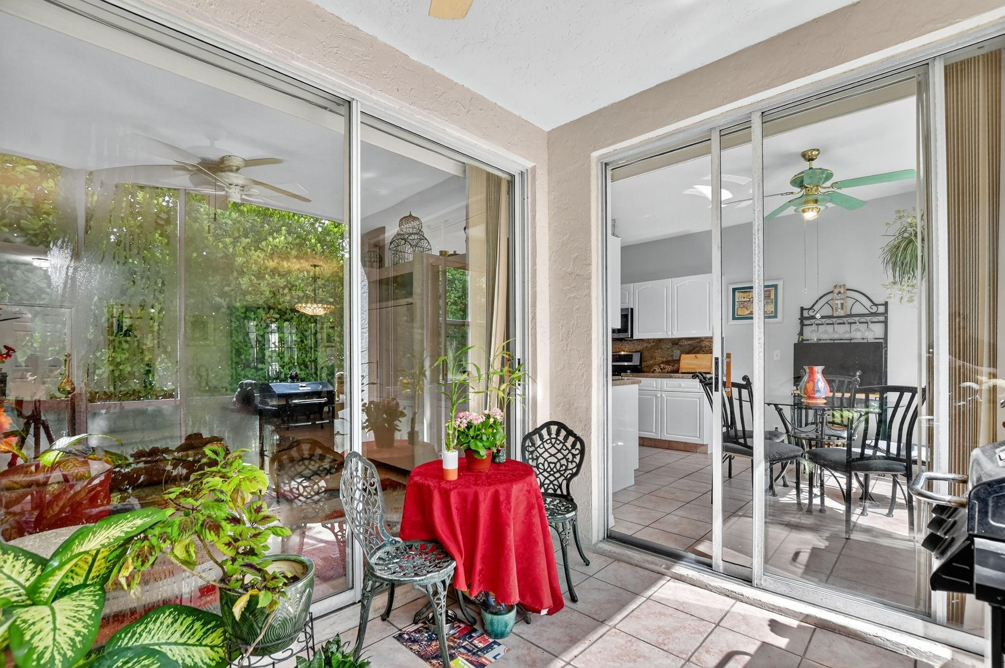 12614 Tiboli Chase Court, Unit 1 Boca Raton, FL 33496 - Photo 32 of 62 a living room filled with furniture and a potted plant