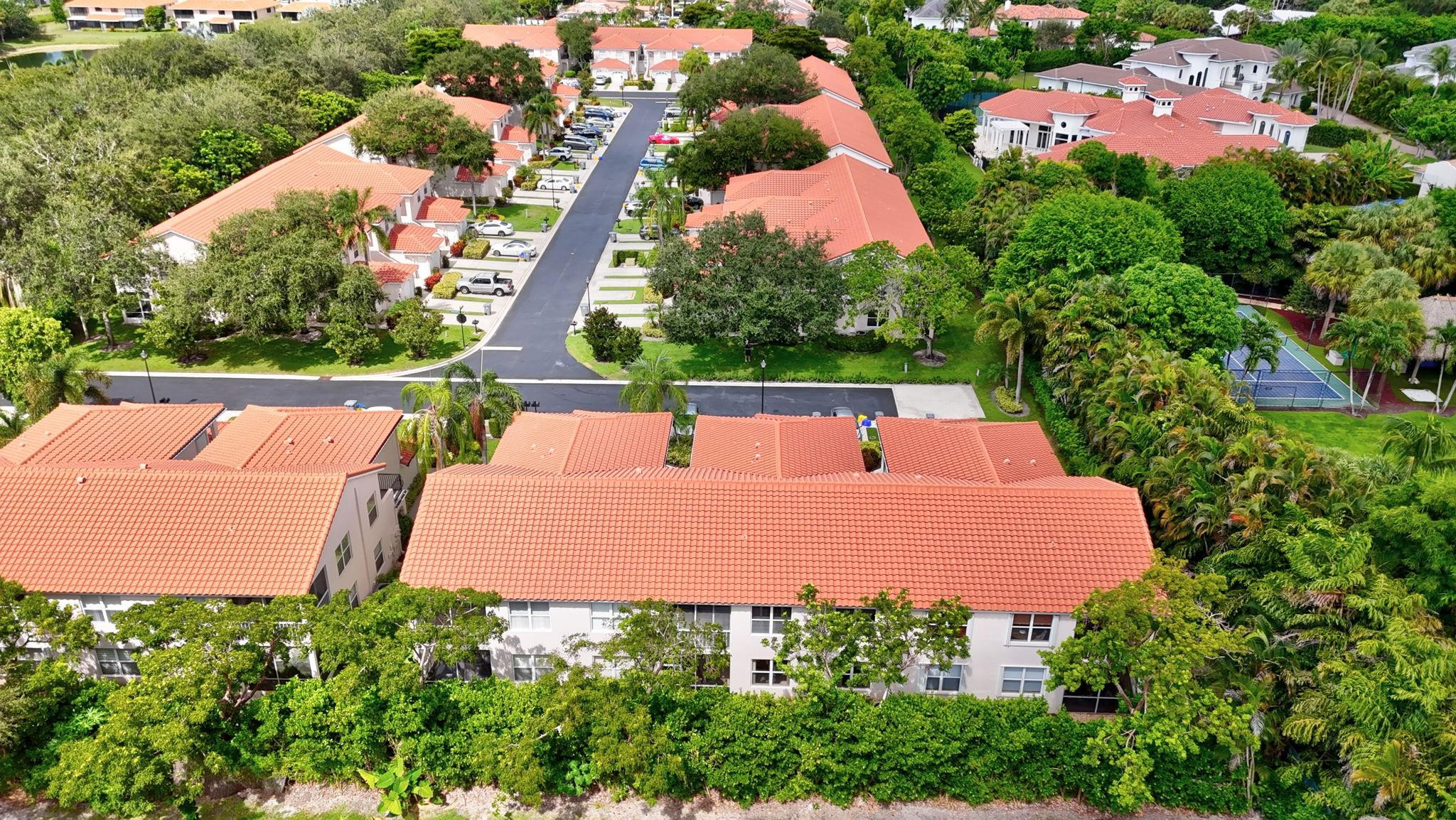 12614 Tiboli Chase Court, Unit 1 Boca Raton, FL 33496 - Photo 39 of 62 an aerial view of a house with yard swimming pool and outdoor seating