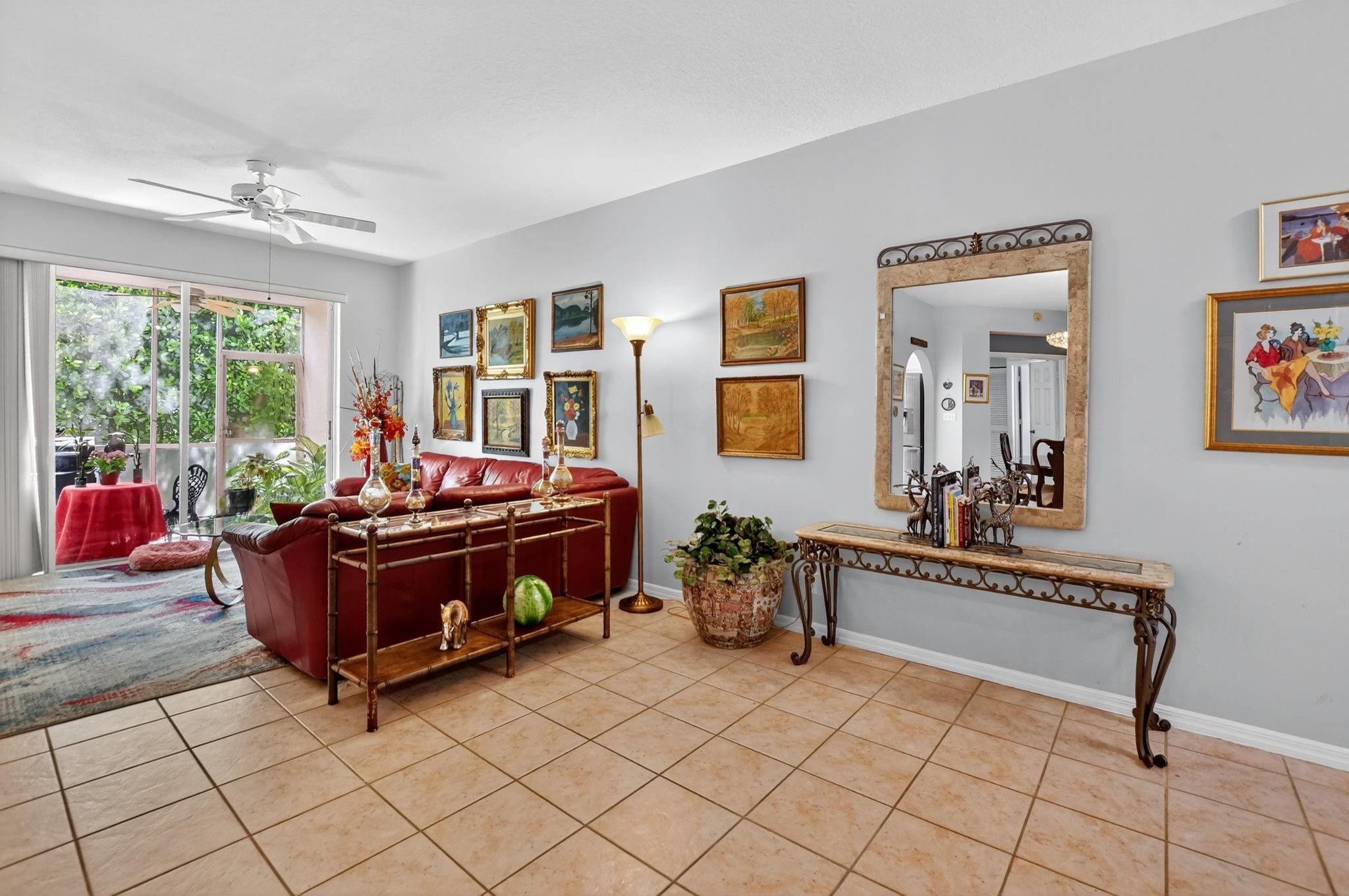 12614 Tiboli Chase Court, Unit 1 Boca Raton, FL 33496 - Photo 6 of 62 a living room with furniture and a table