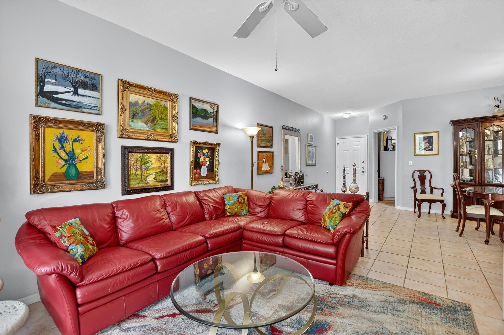 12614 Tiboli Chase Court, Unit 1 Boca Raton, FL 33496 - Photo 7 of 62 a living room with furniture and a large window