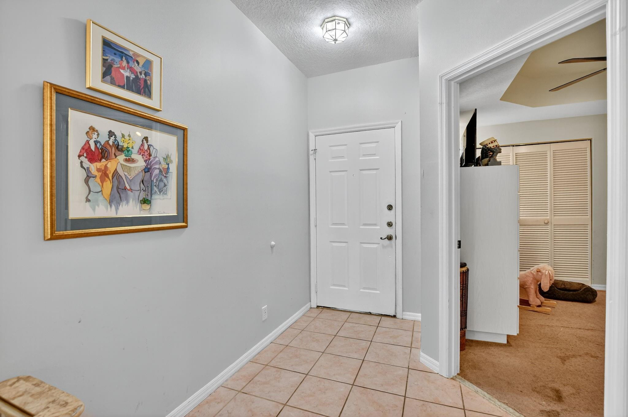 12614 Tiboli Chase Court, Unit 1 Boca Raton, FL 33496 - Photo 9 of 62 a view of a hallway with closet
