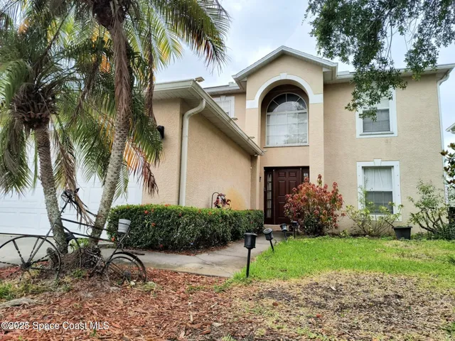 a house view with a garden space