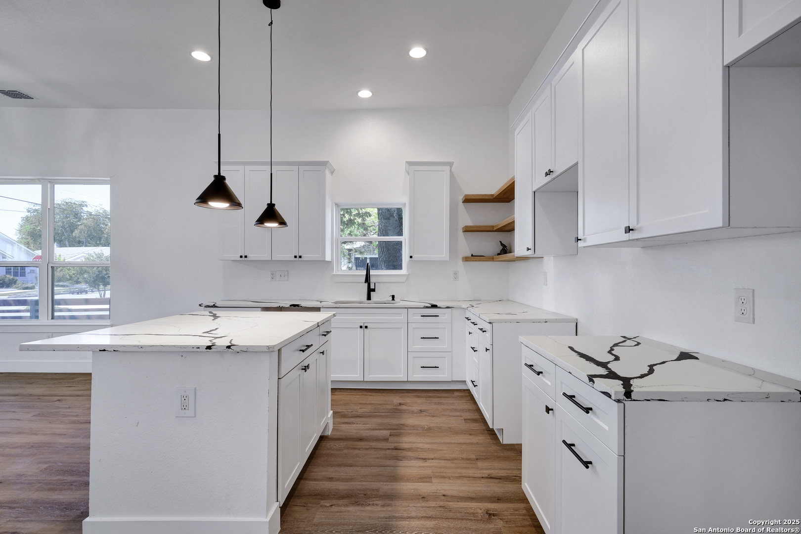2425 Monterey Street San Antonio, TX 78207 - Photo 14 of 35 a kitchen with granite countertop a sink a stove and cabinets