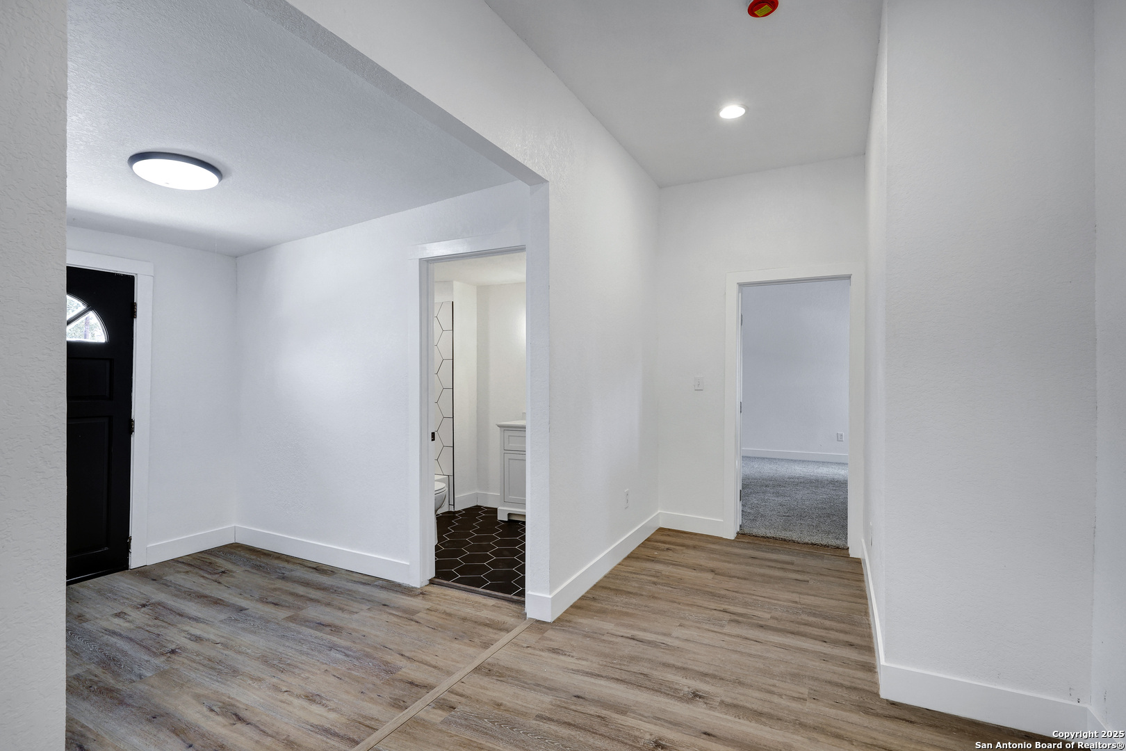 2425 Monterey Street San Antonio, TX 78207 - Photo 15 of 35 wooden floor in an empty room with wooden floor
