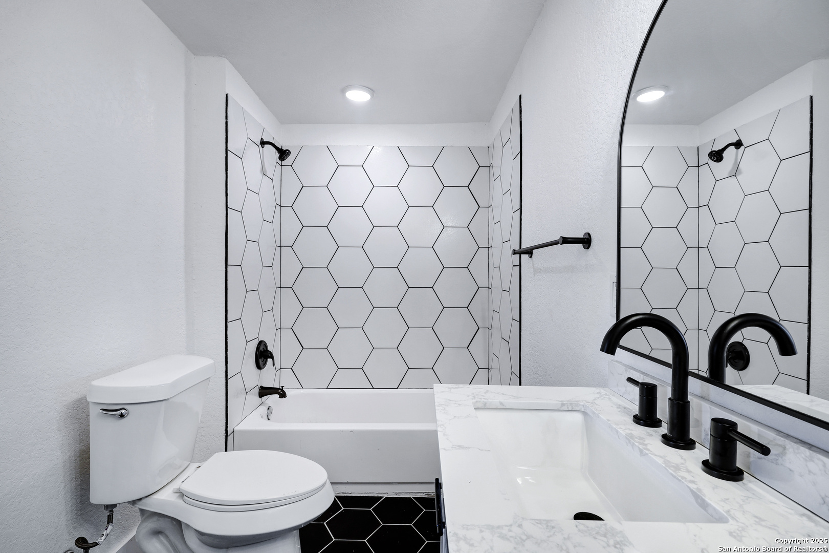 2425 Monterey Street San Antonio, TX 78207 - Photo 22 of 35 a bathroom with a sink a toilet and a bathtub