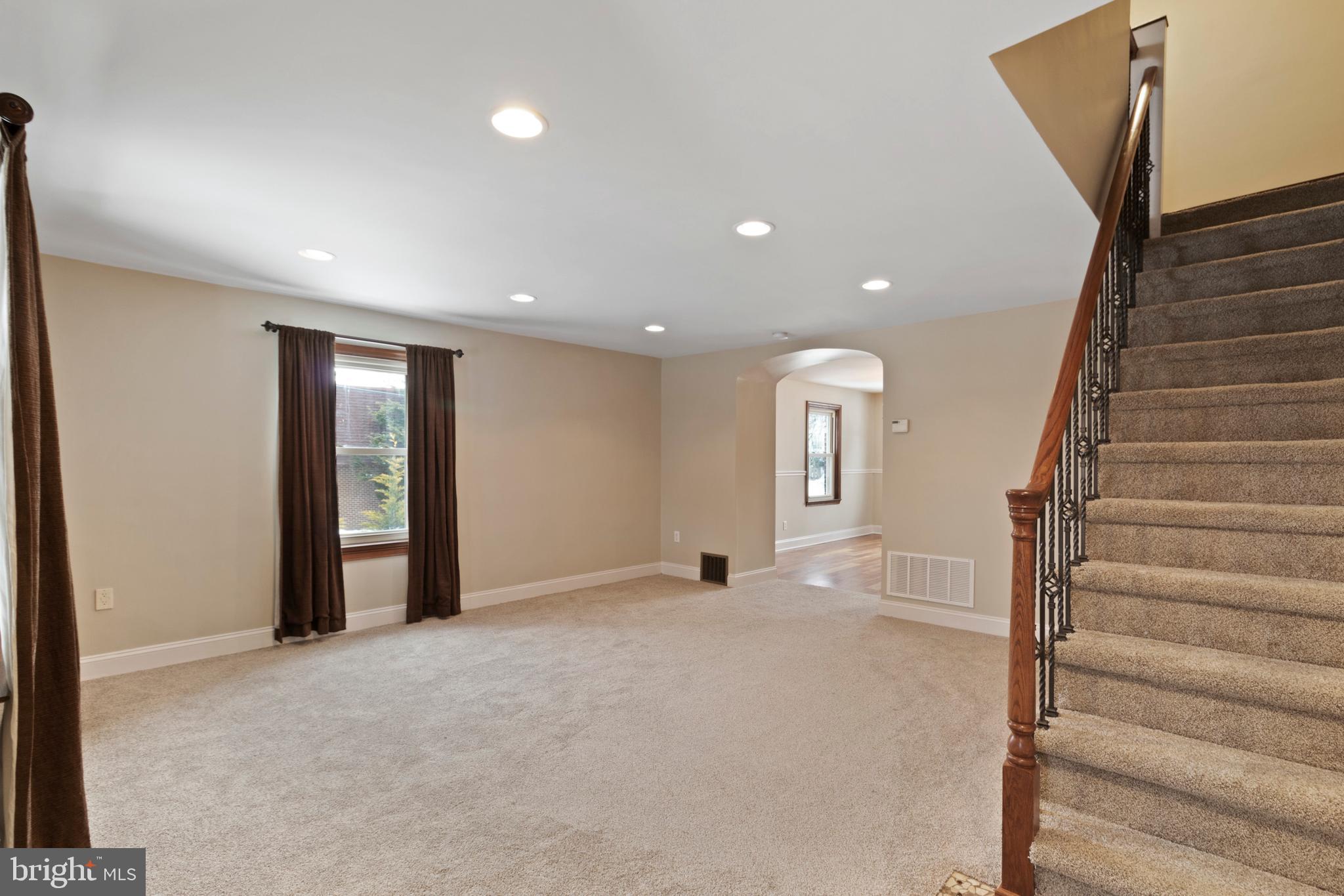 480 Jacksonville Road Hatboro, PA 19040 - Photo 2 of 34 a view of an empty room with wooden floor and stairs