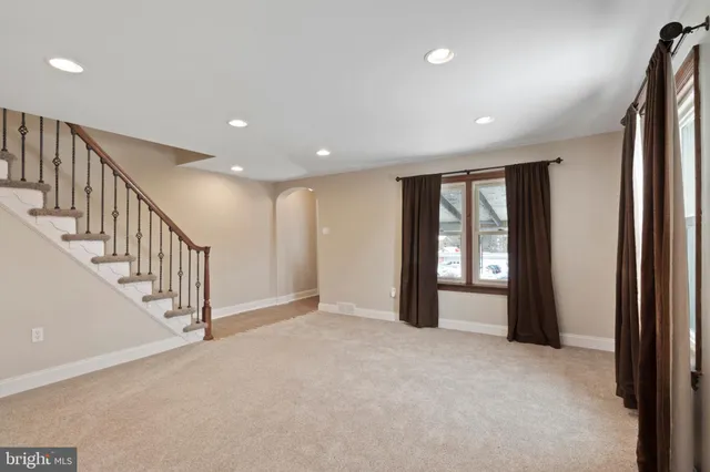 a view of an empty room with stairs