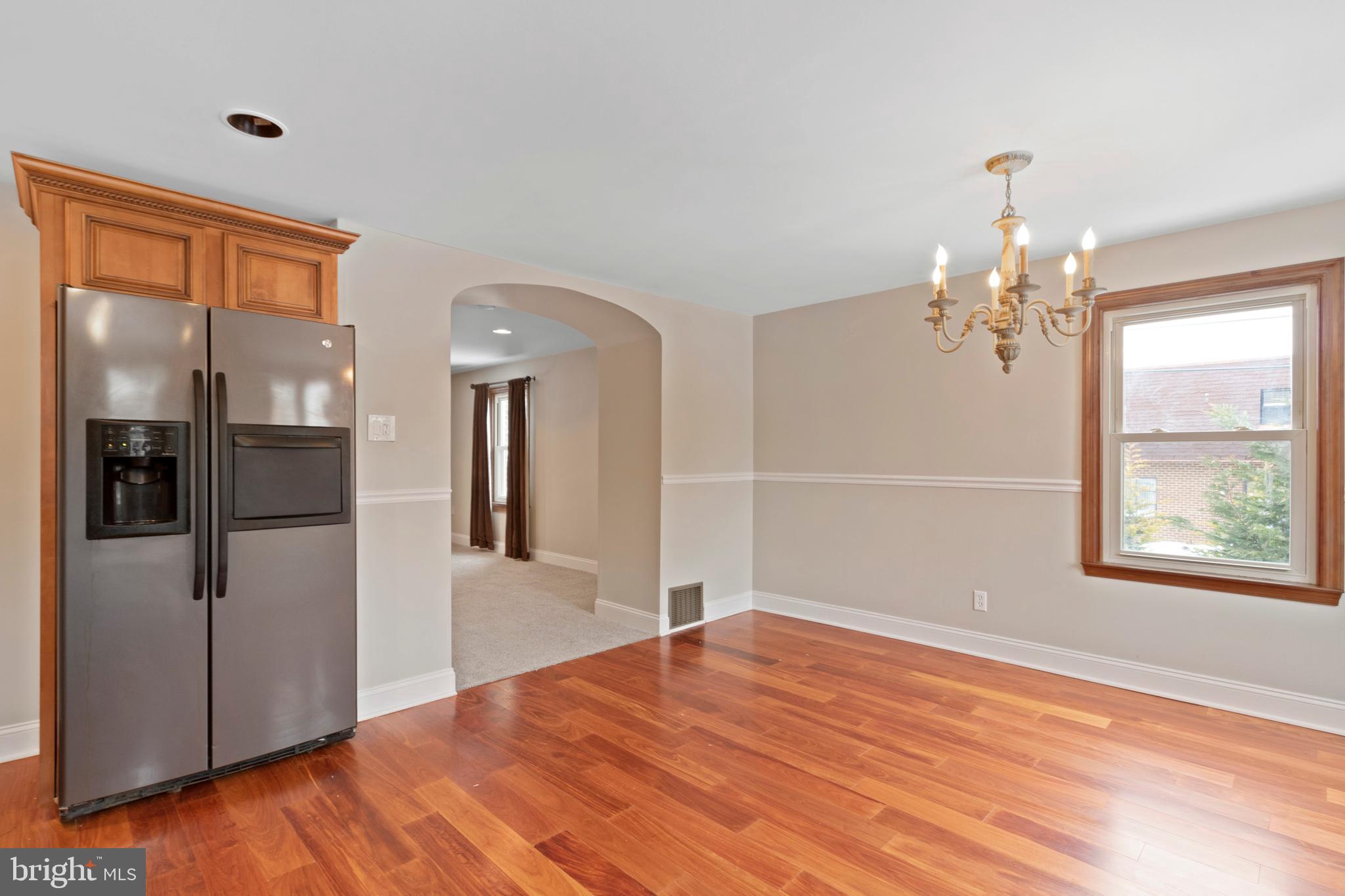 480 Jacksonville Road Hatboro, PA 19040 - Photo 9 of 34 a view of a hallway with wooden floor and a chandelier