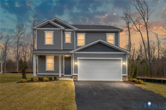 a front view of a house with yard