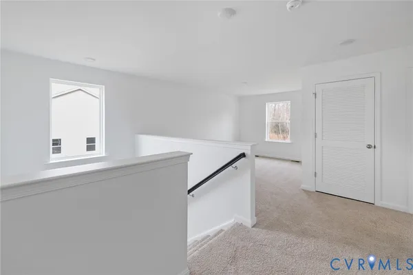 a view of an empty room with windows