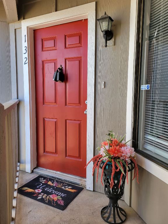 1740 Timber Ridge Road, Unit 132 Austin, TX 78741 - Photo 1 of 16 a living room with furniture and flowers