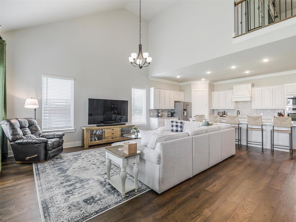 544 Majors Road Van Alstyne, TX 75495 - Photo 2 of 36 a living room with furniture kitchen view and a flat screen tv